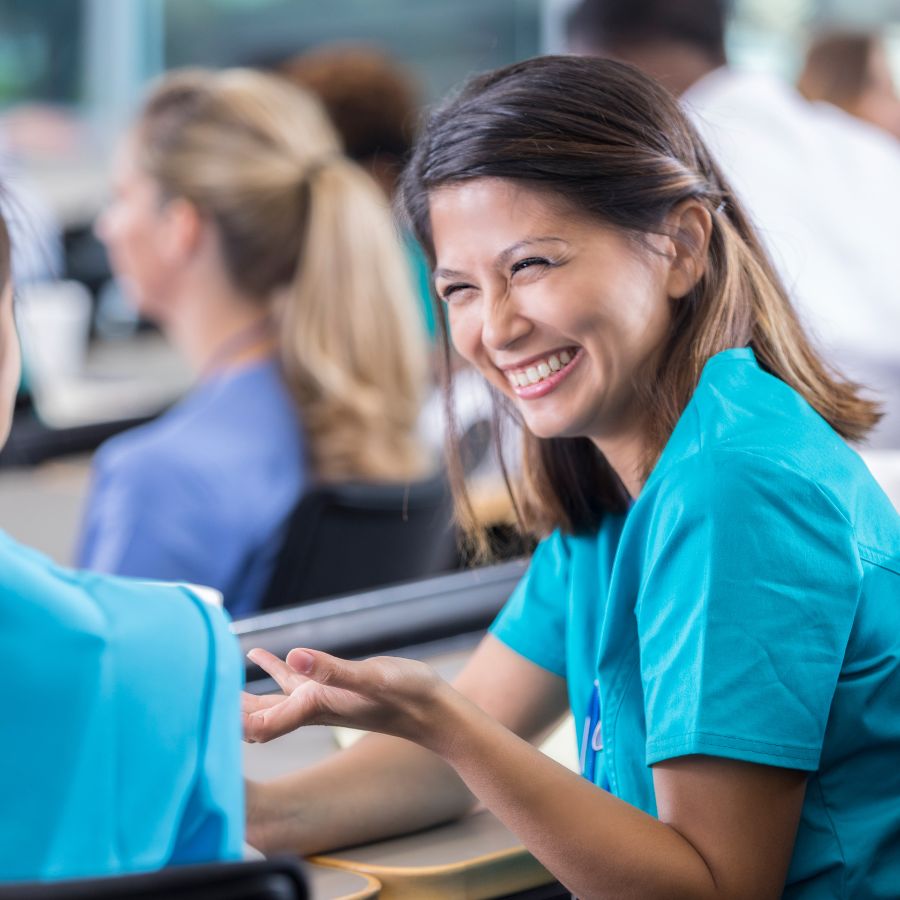 A care worker smiling during training